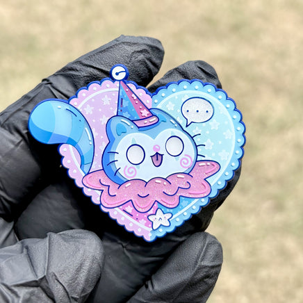 Bluebell enamel pin by Bexii_Draws - heart-shaped soft enamel pin with glitter effects featuring a cute blue cat character